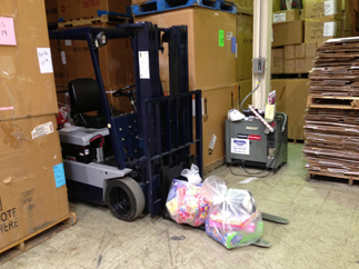 Forklift with 2 childrens toy bags to ship
